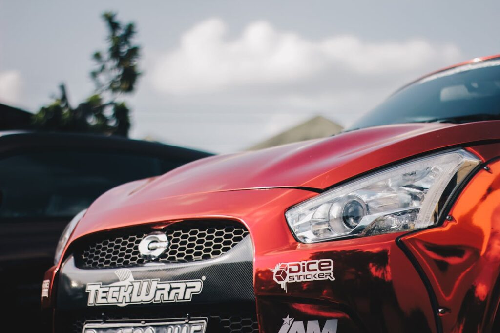 Crafting Captivating Headlines: Your awesome post title goes here A detailed view of a shiny, red sports car front with custom decals.